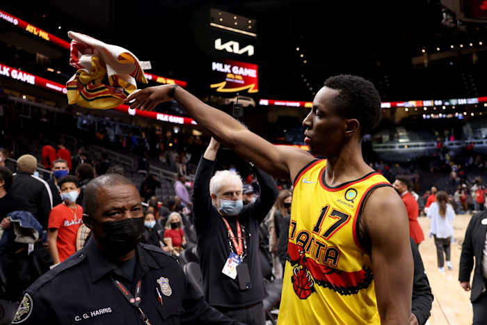Jan 17, 2022; Atlanta, Georgia, USA; Atlanta Hawks forward Onyeka Okongwu (17) throws a towel into the stands as he celebrates their win against the Milwaukee Bucks at State Farm Arena.